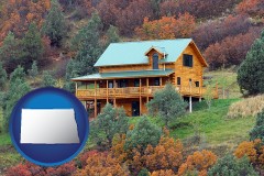 north-dakota map icon and a mountainside vacation home