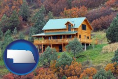 nebraska map icon and a mountainside vacation home