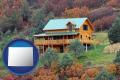 wyoming map icon and a mountainside vacation home